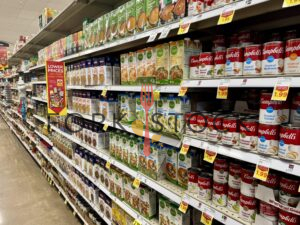Soup And Broth Cans And Containers At A Grocery Store