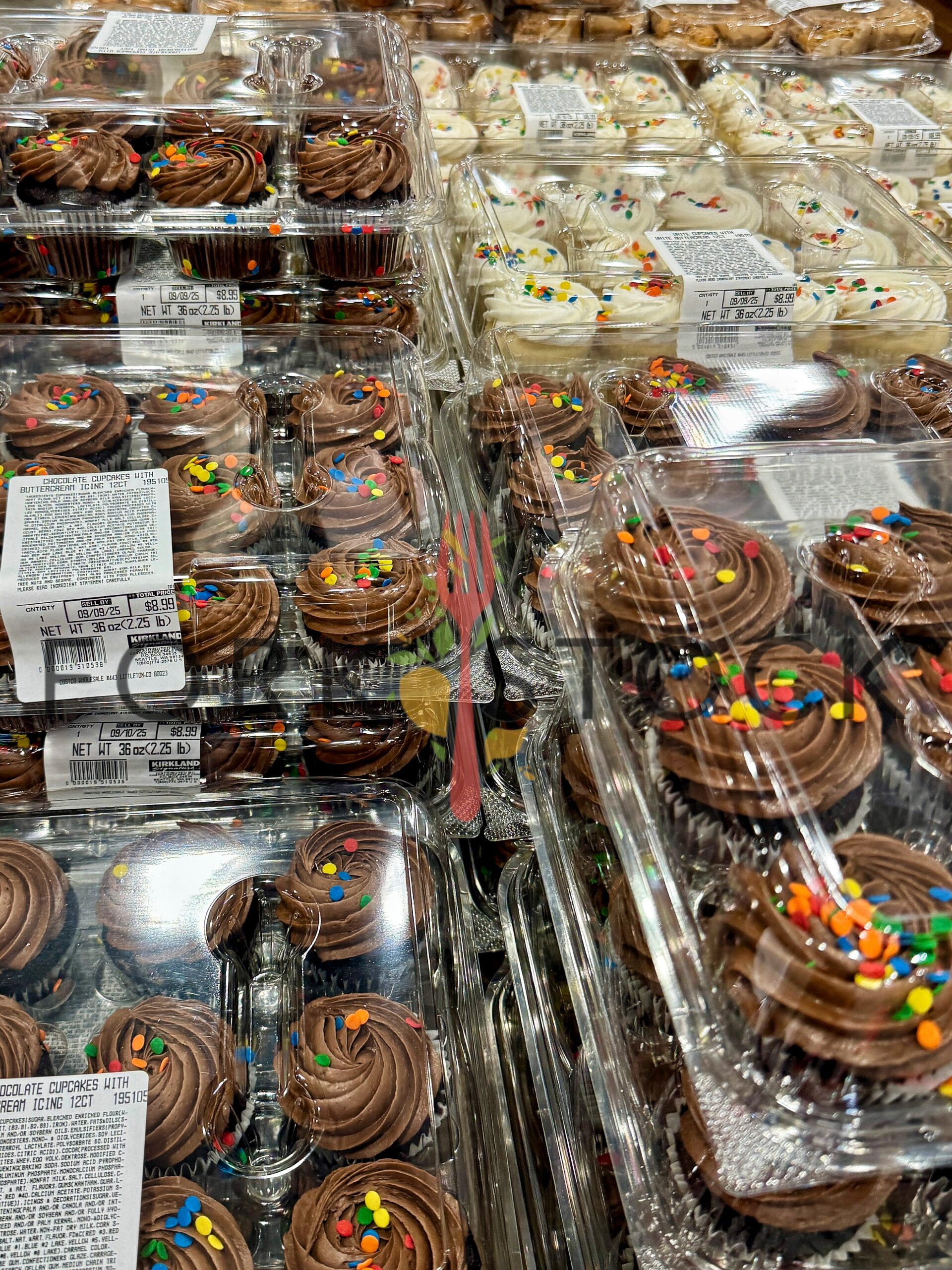 Tables Of Chocolate and Vanilla Cupcake Trays On Display