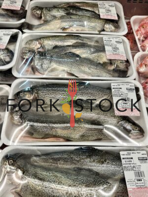 Farm Raised Whole Trout In A Grocery Store (Portrait)