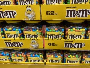 Stacked Trays Of 62oz Peanut M&M's Candy Tubs