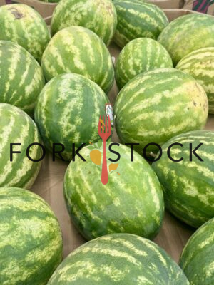Several Watermelons On A Pallet At A Grocery Store