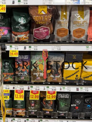 Coffee Varieties At A Grocery Store Shelf