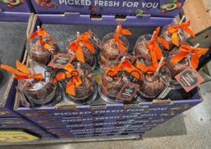 A Tray Of Caramel Apples With Roasted Peanuts
