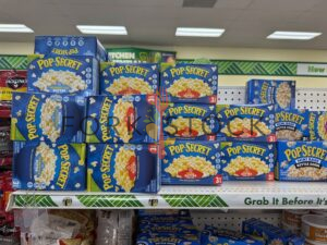 Boxes Of Pop Secret Extra Butter Popcorn Stacked On A Shelf