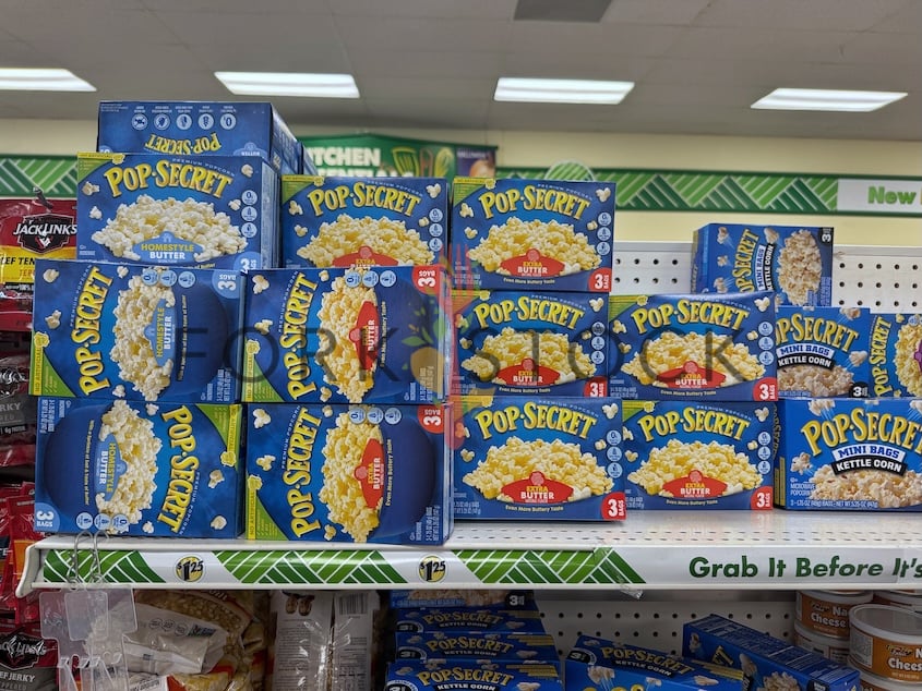 Boxes Of Pop Secret Extra Butter Popcorn Stacked On A Shelf