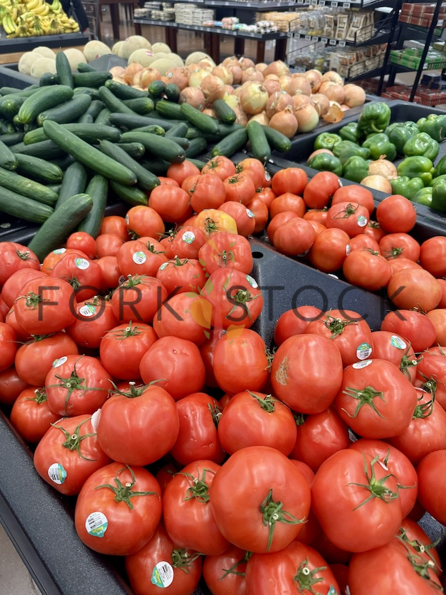 Tomatoes Cucumbers Onions And Peppers At A Walmart Produce Section