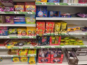 Various Candy On Shelves At A Discount Store
