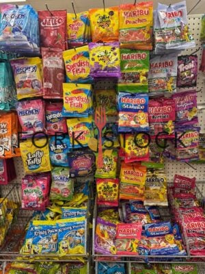 Various Candy On Retail Hooks At A Discount Store