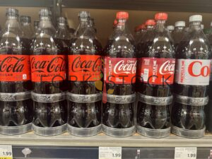Coca Cola Coke Bottles On A Shelf