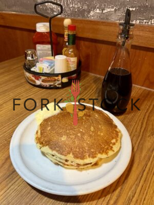 Dennys Pancakes On Booth Table With Syrup Portrait